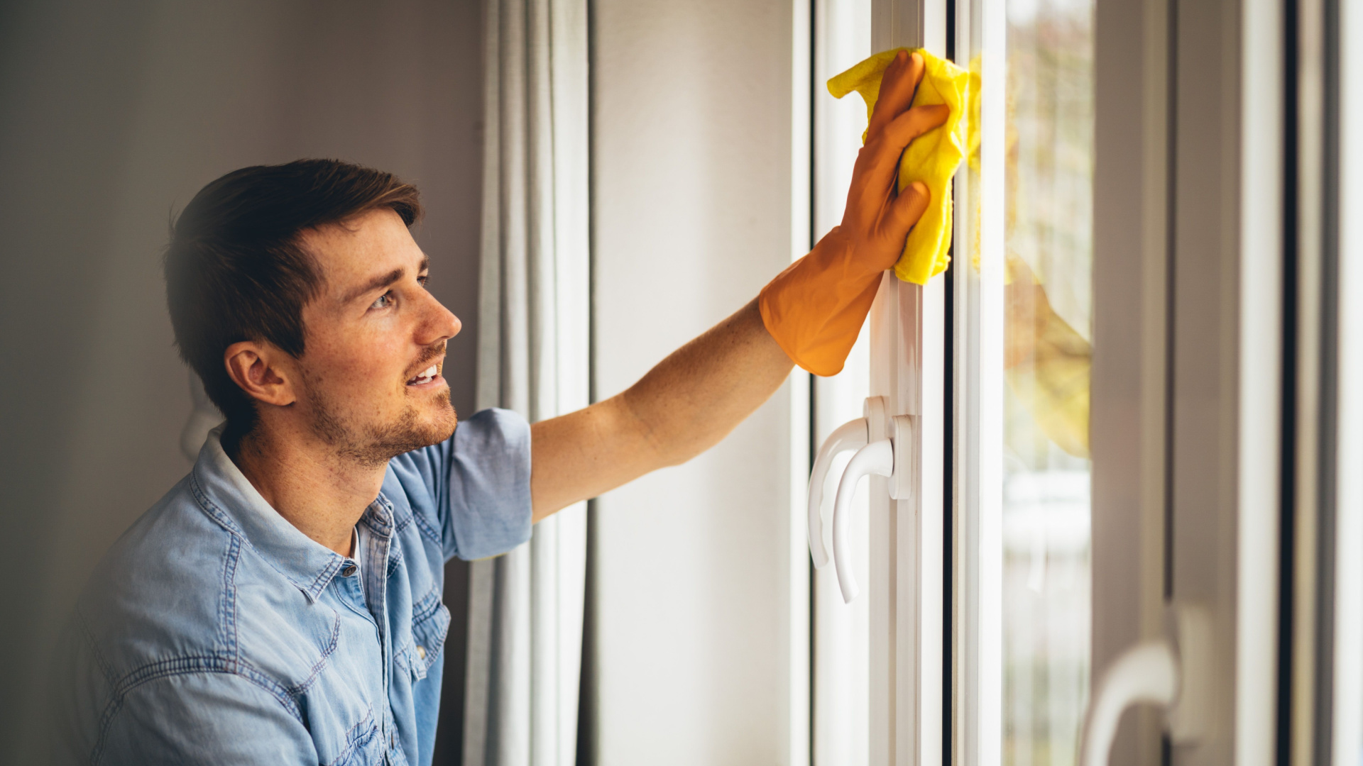 young man cleaning the house
